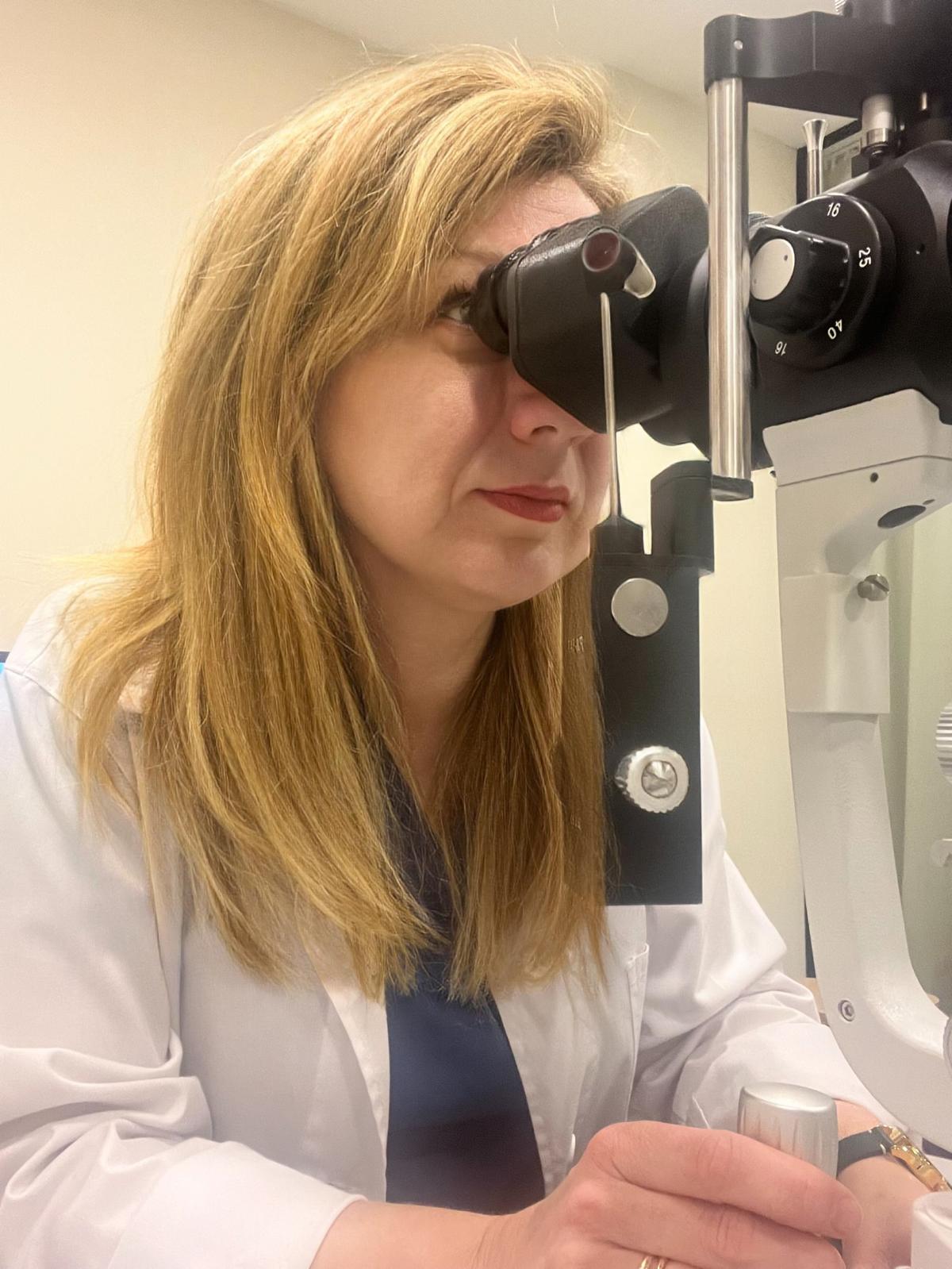 doctor conducting operation at patient in operating room